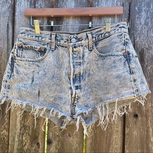 Vintage high waisted Levi’s distressed jean shorts